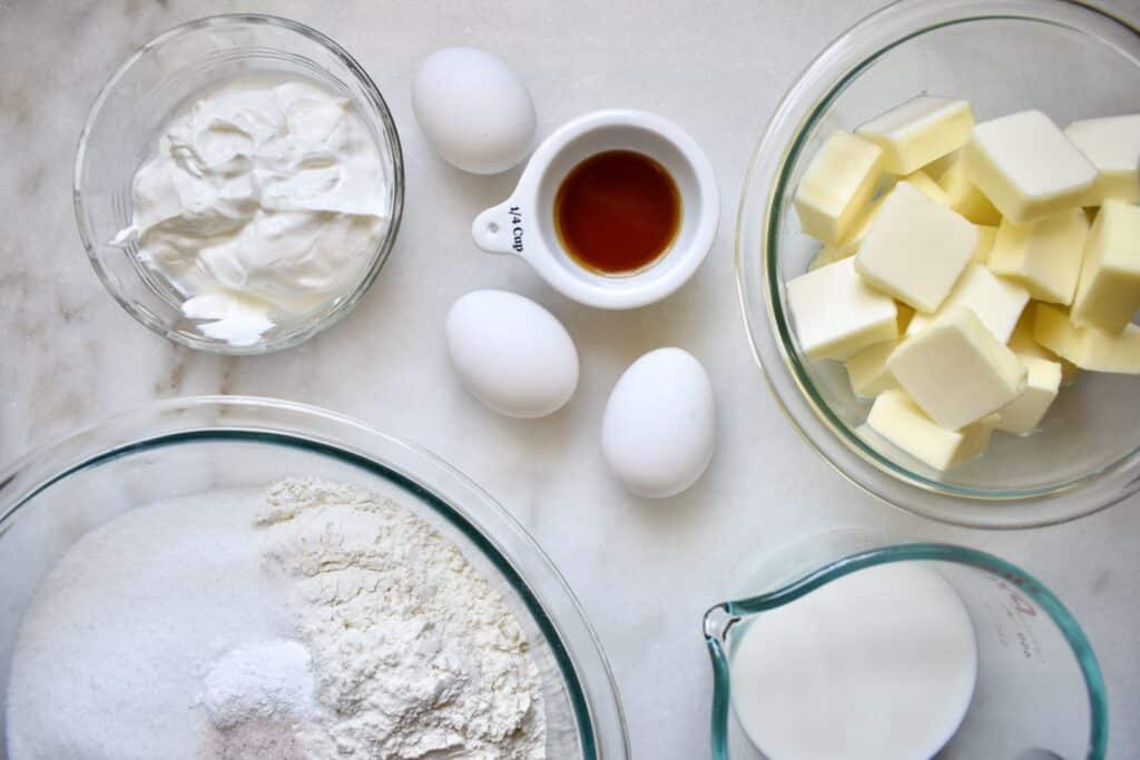 overhead shot of vanilla cupcake recipe ingredients pre-portioned in bowls