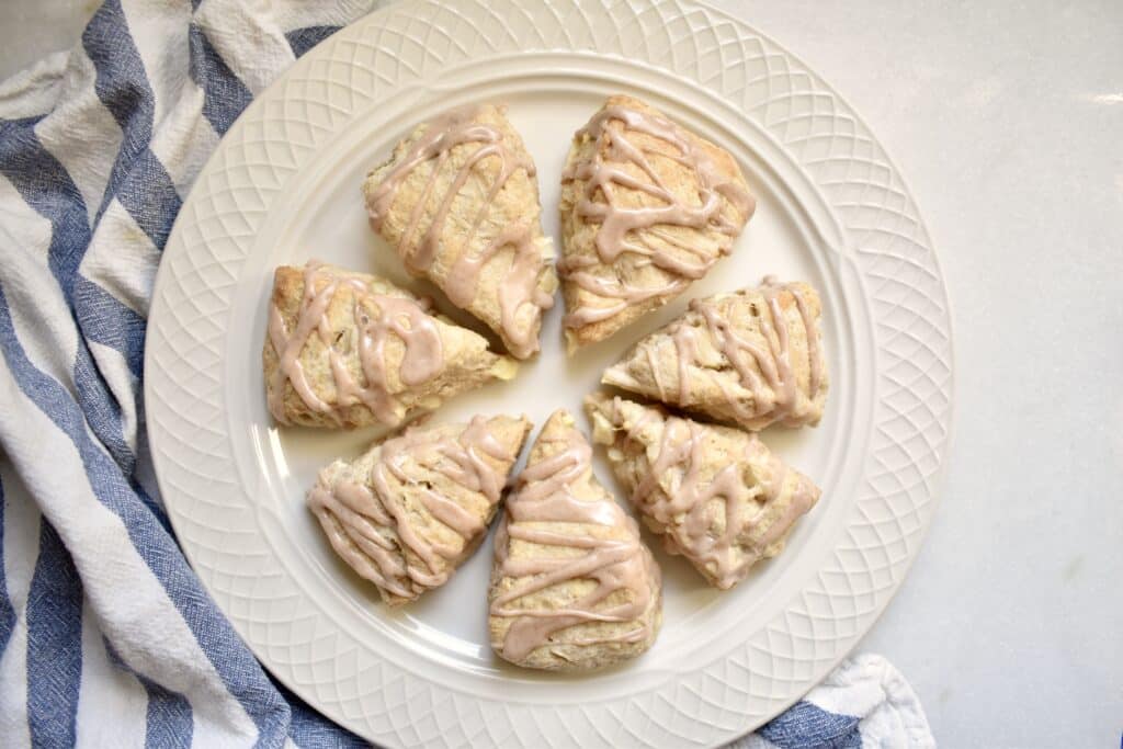 overhead shot of cut scones on white plate